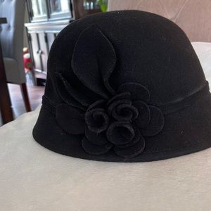 Black hat with flower on the side